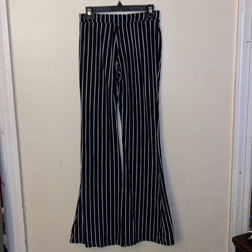 Size is a medium, stripe print black and white.